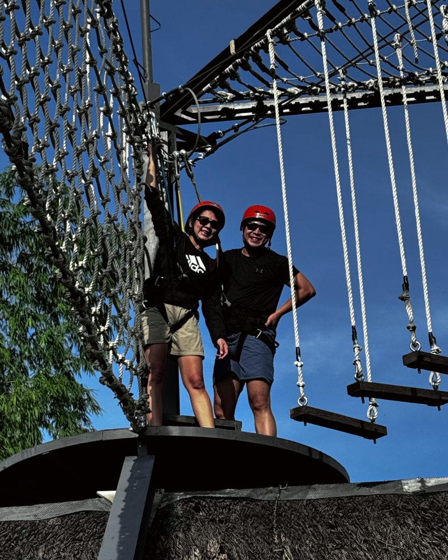 Justin and Nina on a high ropes course