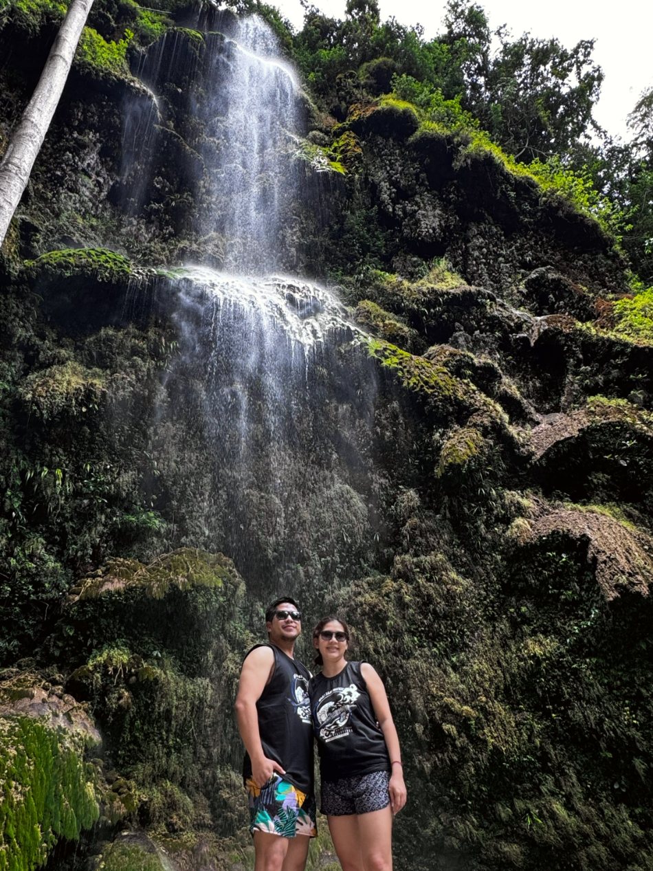 Justin and Nina at the foot of a waterfall